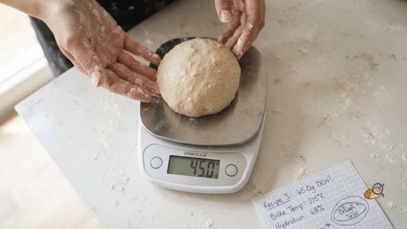 Cookie dough ball on a digital scale reading 45.0 grams